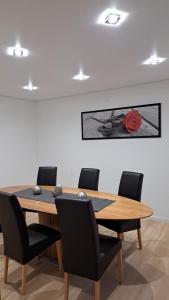 a conference room with a wooden table and chairs at Haus Linde in Wengenroth
