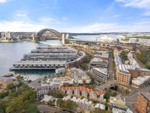 an aerial view of a city with a bridge at Heritage Terrace with Harbour Glimpses for 6 in Sydney