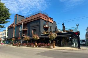 a building on the corner of a street at Adeti Residence in Nesebar