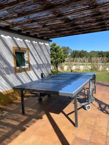a ping pong table on a patio at Monte dos Pintos in Arronches