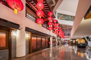 a hallway with red lanterns hanging from the ceiling at Beijing Landmark Hotel in Beijing
