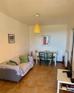 a living room with a couch and a table at Rossola House in Bonassola