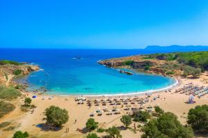 an aerial view of a beach with umbrellas and people at Thalassini in Daratso