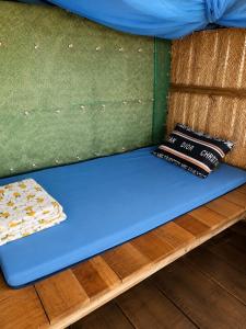a blue mattress sitting on a bunk bed at Cactos Floating House Experience on Island in Lai Sơn