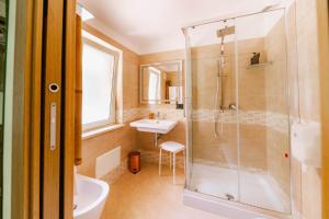 a bathroom with a shower and a sink at Oasi Scolacium in Villaggio Le Rocelle