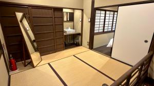 a view of a bathroom with a door and a sink at Kyoto Gion No Yado in Kyoto +44 photos