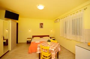 Posteľ alebo postele v izbe v ubytovaní Apartments Joško