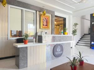 a lobby of a restaurant with a counter at Geetanjali hotel and resort in Udaipur +18 photos