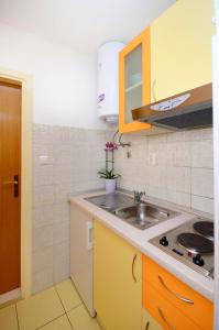 Kuchyňa alebo kuchynka v ubytovaní Apartments Joško
