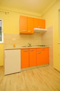 Kuchyňa alebo kuchynka v ubytovaní Apartments Joško