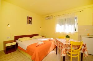 Posteľ alebo postele v izbe v ubytovaní Apartments Joško