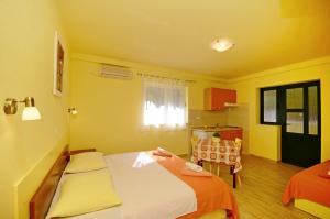 Posteľ alebo postele v izbe v ubytovaní Apartments Joško