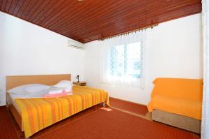 Posteľ alebo postele v izbe v ubytovaní Apartments Joško