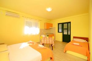Posteľ alebo postele v izbe v ubytovaní Apartments Joško