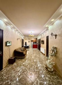 a large living room with a couch and a table at Hotel Vera View in Tbilisi City