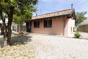 a small house with a tree in front of it at TRAIN HOUSE in Treviso