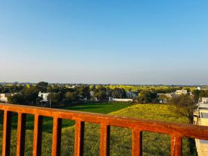 a view of a city from a balcony at Hotel Rajasthan Inn in Behror