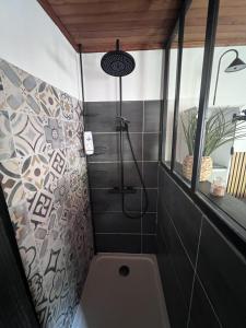 a bathroom with a shower with a toilet in it at Gîte du Riou Sec in La Roque-Sainte-Marguerite