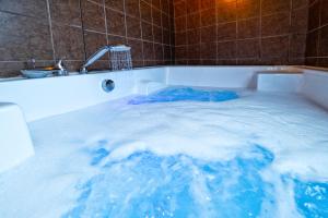 a tub filled with lots of blue water at Terra Rossa in Antalya
