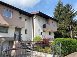 a apartment building with a gate in front of it at Holiday Home Ilidza Ella in Sarajevo
