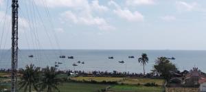 a group of people in boats in the water at Phuc Hau Hotel - Ly Son in Ly Son