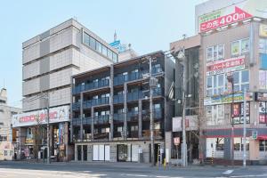 a building on the corner of a city street at Cavatina in Sapporo
