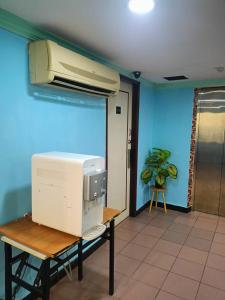 a computer monitor sitting on a table in a room at HWKl in Kuala Lumpur