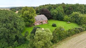 an aerial view of a house in the middle of a field at Charlottenhof in Wangels