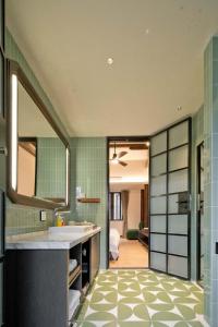 a bathroom with a sink and a mirror at ALOR VALLEY HUZHOU in Huzhou +116 photos