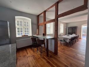 a kitchen and dining room with a table and chairs at Charlottenhof in Wangels