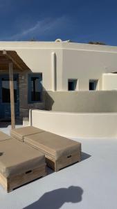 two beds on the roof of a house at Akrorama private villas and suites in Akrotiri