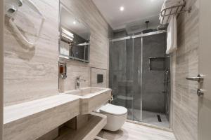 a bathroom with a toilet and a sink and a shower at Stern Hotel Karaköy-Special Class in Istanbul +26 photos
