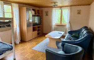 a living room with a couch and a table at Ytterbo in Hultsfred