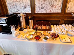 a table with a buffet of food on it at Rezydencja Jagiellońska in Sanok
