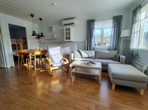 a living room with a couch and a table at Tärnaby Sportstugor in Tärnaby