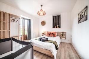 a bedroom with a bed and a window at Cosy House in Sillingy