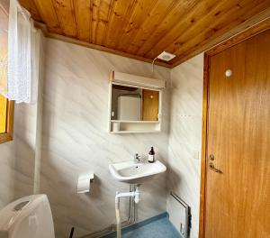 a small bathroom with a sink and a toilet at Ytterbo in Hultsfred +10 photos