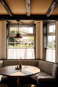 a dining room with a table and a window at The General Tarleton in Knaresborough +16 photos