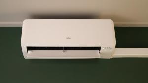 a white printer hanging on a wall at Restaurant & Hotel De Jaeger in Ruurlo +12 photos