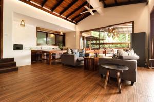 a living room with a couch and a table at Veranda Natural Resort in Kep