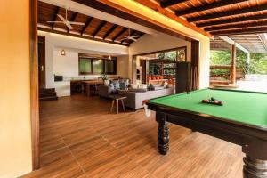 a pool table in the middle of a living room at Veranda Natural Resort in Kep