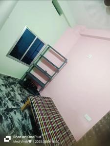 an overhead view of a room with a bunk bed at Pallavi girl hostel in Laheria Sarāi