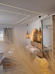 a room with a reflection in a mirror at Keti Kapri in Plaka +172 photos