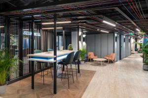 an office with a table and chairs and plants at Silk Mill Edinburgh in Edinburgh