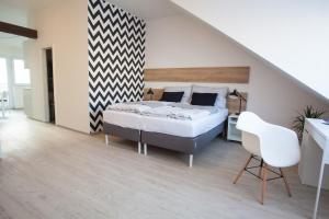 Posteľ alebo postele v izbe v ubytovaní Haas Apartments