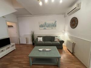 a living room with a couch and a coffee table at Vilasardemarlux2 in Vilassar de Mar