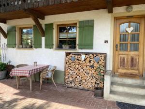 a table and chairs sitting outside of a house at Haus Dekostüble in Münstertal