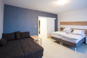 Posteľ alebo postele v izbe v ubytovaní Haas Apartments