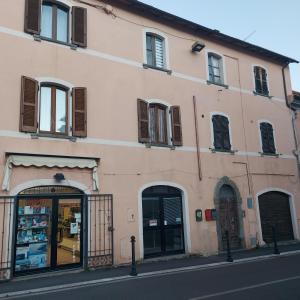 a building on a street with a store at Eva'house in Bolsena