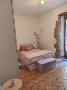 a bedroom with a bed and a mirror at Eva'house in Bolsena